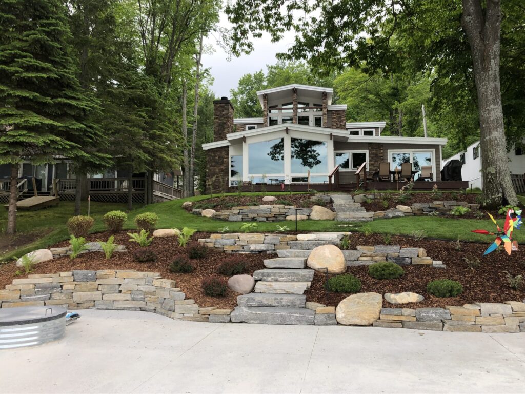 Terraced yard with mulched area and small shrubs in northern Michigan